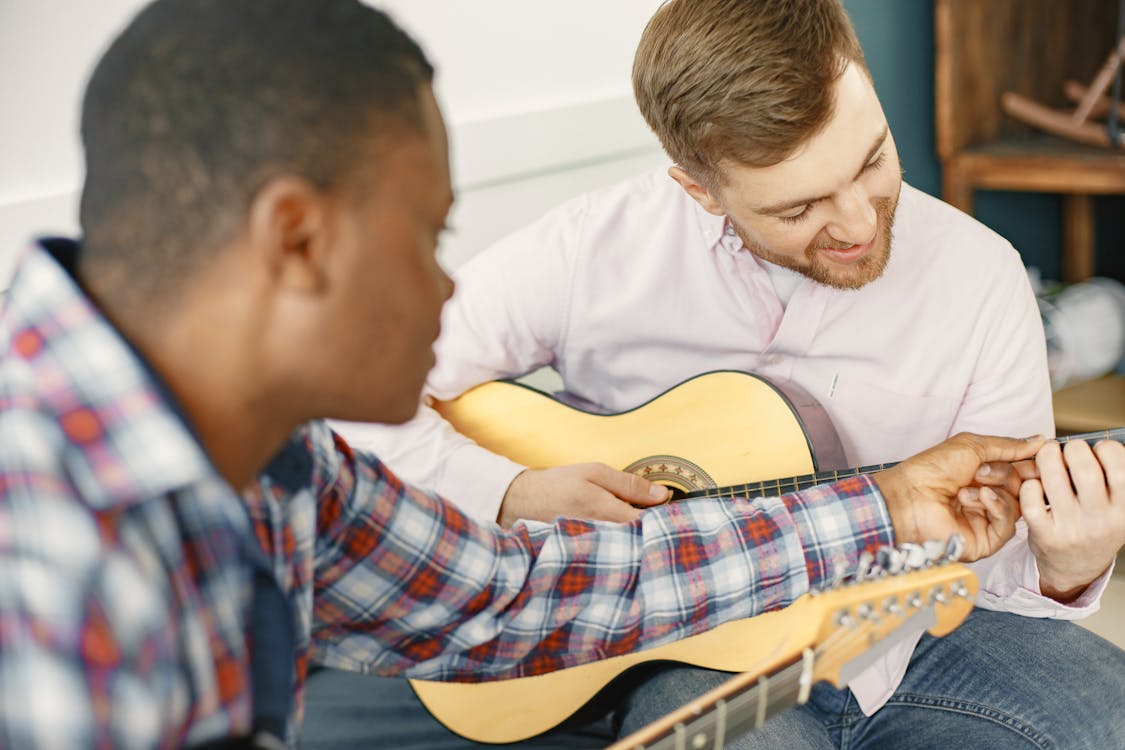 Student teaching guitar